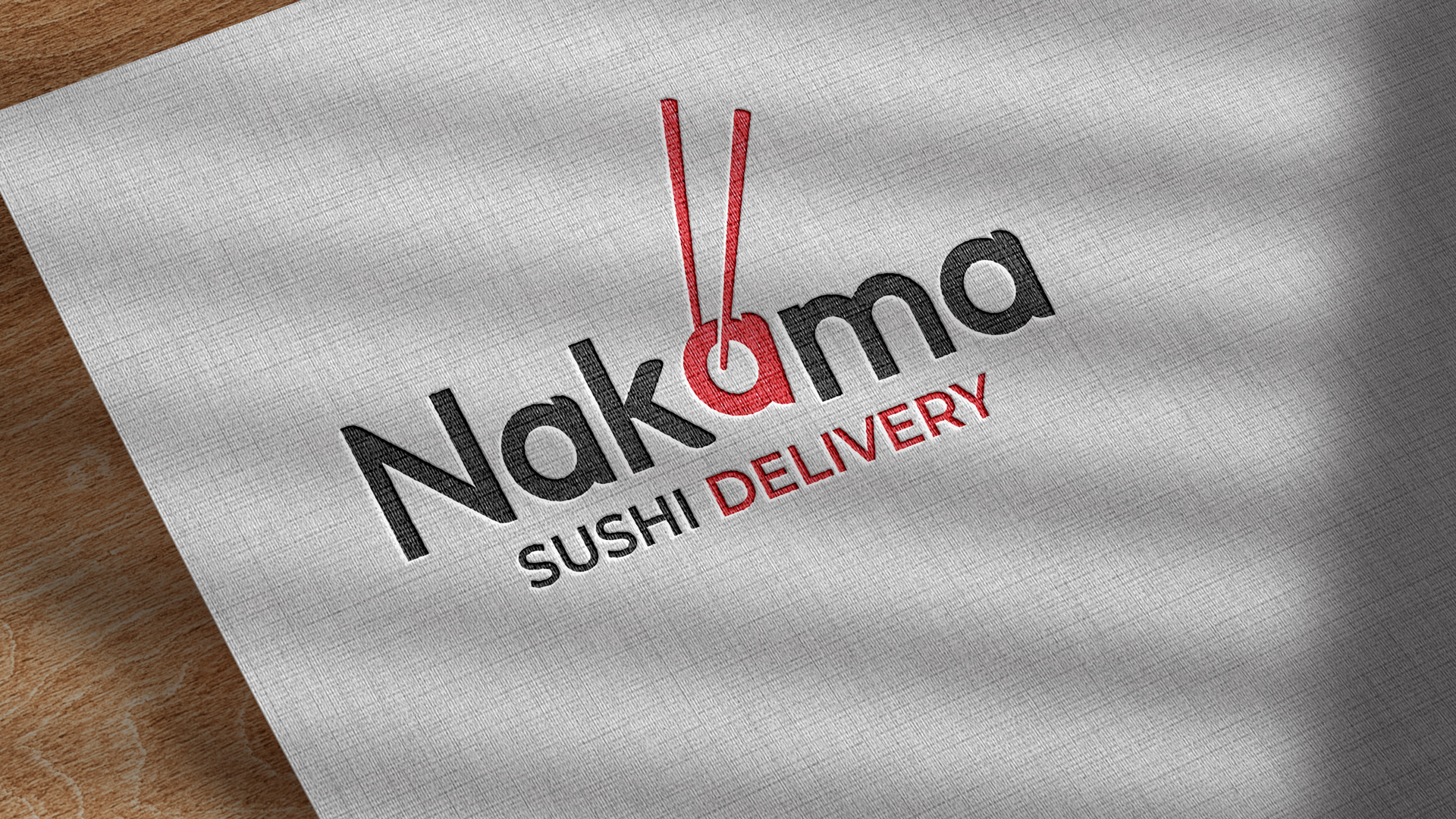 Logo de Nakama Sushi Delivery aplicado sobre papelería de mesa
